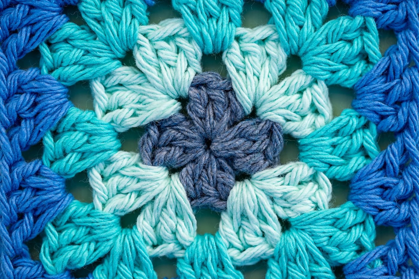 A chunky blue and teal granny square